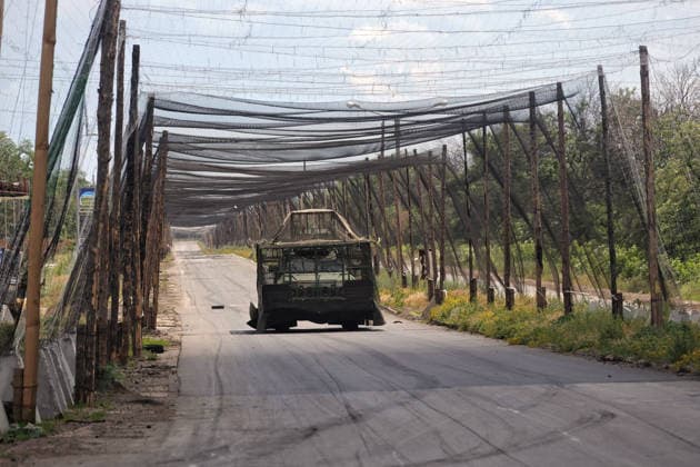 RECORD DATE NOT STATED Ukrainian Military Vehicles Travel Through Donetsk Region - Ukraine An armored military vehicle fitted with additional protection against Russian FPV drone strikes travels along a road protected by anti-drone nets in Donetsk region, Ukraine, on June 20, 2026 (Photo by Nina Liashonok Ukrinform ABACAPRESS.COM) Odesa Ukraine  Copyright: xLyashonokxNina Ukrinform ABACAx
