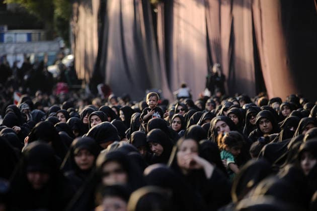 Iranians gather to mark Muharram in Tehran TEHRAN, IRAN - JUNE 22: Shiite Muslims dressed in black wear religious headbands attends a mourning ceremony marking the month of Muharram at the Imamzadeh Ali Akbar Shrine in northern Tehran, Iran on June 22, 2026. Participants gathered to commemorate Hazrat Hussein, the grandson of Prophet Muhammad, and his 72 companions who were martyred in the Battle of Karbala, accompanying the traditional elegies and lamentations. Fatemeh Bahrami Anadolu Tehran Iran. Editorial use only. Please get in touch for any other usage.  Copyright: x2026xAnadoluxFatemehxBahramix