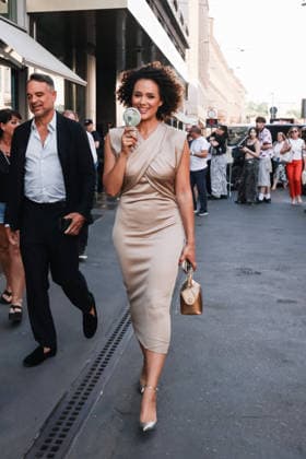 IPA85954301 - Milan, Milan Fashion Week Menswear Spring Summer 2027 - Men s Fashion, Spring Summer 2027 - Giorgio Armani Fashion Show - Guests arriving. Pictured: Nathalie Emmanuel (British actress and model) walking down the street with a fan because of the heat  Copyright: xAlessandroxBremecx xx 85954301