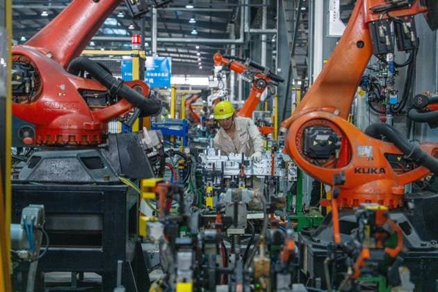 JINHUA, CHINA - JUNE 22: An employee works on the production line at the workshop of new energy vehicle components enterprise on June 22, 2026 in Jinhua, Zhejiang Province of China.  Copyright: xVCGx 111649698785