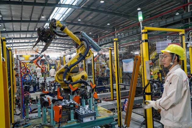 JINHUA, CHINA - JUNE 22: An employee works on the production line at the workshop of new energy vehicle components enterprise on June 22, 2026 in Jinhua, Zhejiang Province of China.  Copyright: xVCGx 111649698770