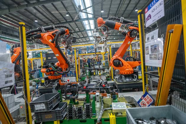 JINHUA, CHINA - JUNE 22: Industrial robots work on the production line at the workshop of new energy vehicle components enterprise on June 22, 2026 in Jinhua, Zhejiang Province of China.  Copyright: xVCGx 111649698772