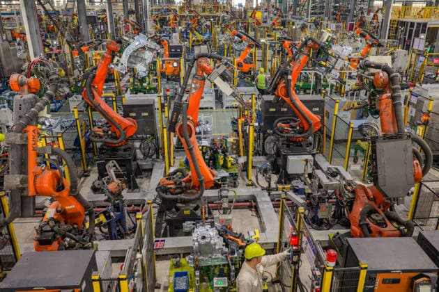 JINHUA, CHINA - JUNE 22: Industrial robots work on the production line at the workshop of new energy vehicle components enterprise on June 22, 2026 in Jinhua, Zhejiang Province of China.  Copyright: xVCGx 111649698761