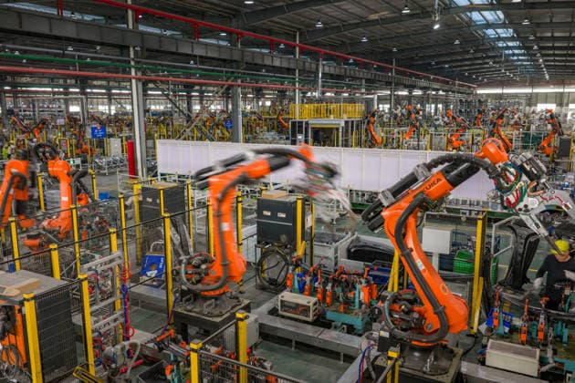 JINHUA, CHINA - JUNE 22: Industrial robots work on the production line at the workshop of new energy vehicle components enterprise on June 22, 2026 in Jinhua, Zhejiang Province of China.  Copyright: xVCGx 111649698762