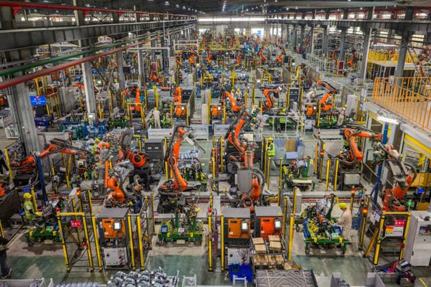 JINHUA, CHINA - JUNE 22: Industrial robots work on the production line at the workshop of new energy vehicle components enterprise on June 22, 2026 in Jinhua, Zhejiang Province of China.  Copyright: xVCGx 111649698754