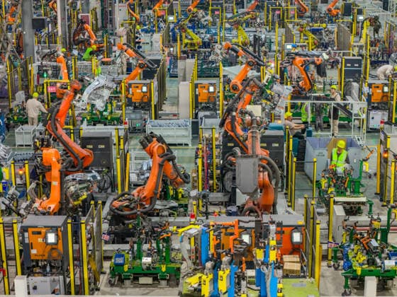 JINHUA, CHINA - JUNE 22: Industrial robots work on the production line at the workshop of new energy vehicle components enterprise on June 22, 2026 in Jinhua, Zhejiang Province of China.  Copyright: xVCGx 111649698755