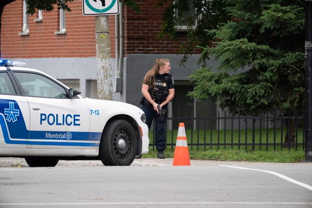June 22, 2026, Montreal, Pq, CANADA: A police officer responds to a shooting in the CoÂ te-des-Neiges district of Montreal on Monday, June 22, 2026. Montreal CANADA  - ZUMAc35_ 20260622_zaf_c35_146 Copyright: xChristopherxKatsarovx