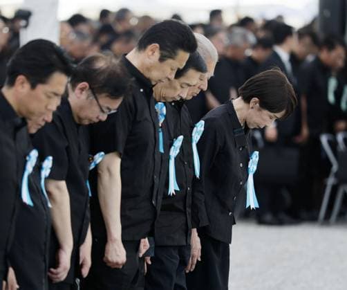 81st anniversary of WWII ground battle in Okinawa Japanese Prime Minister Sanae Takaichi (far R) and other attendees offer silent prayers during a ceremony marking the 81st anniversary of the end of the Battle of Okinawa in World War II, at the Peace Memorial Park in Itoman, Okinawa Prefecture, southern Japan, on June 23, 2026.  A14AA0005619899P