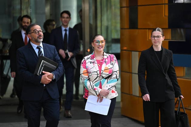 ROBODEBT COMPENSATION, Andrew Grech, partner of Gordon Legal (left) and Felicity Button (centre) arrive to speak to media outside of the Federal Court in Melbourne, Tuesday, June 23, 2026. ( NO ARCHIVING Melbourne Victoria AUSTRALIA  Copyright: xx 20260623190405987514