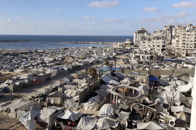 Palestinians displaced by Israeli attacks struggling to survive in makeshift tents GAZA CITY, GAZA, PALESTINE - JUNE 22: Displaced Palestinian families try to sustain their lives with severely limited resources inside an overcrowded makeshift tent camp set up along the Mediterranean coastline of Gaza City, Gaza, Palestine on June 22, 2026. Following more than two years of an intense military blockade and devastating bombardments by Israeli forces, hundreds of thousands of civilians have been forced to flee their homes, finding refuge only in fragile tents or heavily damaged structures. The ongoing conflict has triggered a catastrophic humanitarian crisis, leaving the displaced population struggling daily to access basic necessities such as  Copyright: x2026xAnadoluxAhmedxJihadxIbrahimxAl-arinix