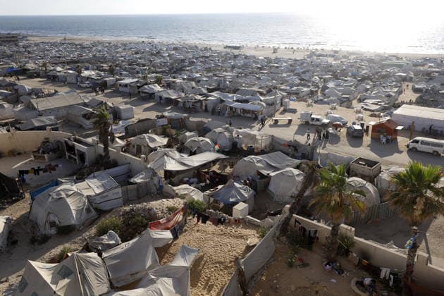 Palestinians displaced by Israeli attacks struggling to survive in makeshift tents GAZA CITY, GAZA, PALESTINE - JUNE 22: Displaced Palestinian families try to sustain their lives with severely limited resources inside an overcrowded makeshift tent camp set up along the Mediterranean coastline of Gaza City, Gaza, Palestine on June 22, 2026. Following more than two years of an intense military blockade and devastating bombardments by Israeli forces, hundreds of thousands of civilians have been forced to flee their homes, finding refuge only in fragile tents or heavily damaged structures. The ongoing conflict has triggered a catastrophic humanitarian crisis, leaving the displaced population struggling daily to access basic necessities such as  Copyright: x2026xAnadoluxAhmedxJihadxIbrahimxAl-arinix
