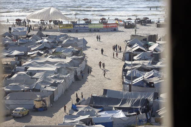 Palestinians displaced by Israeli attacks struggling to survive in makeshift tents GAZA CITY, GAZA, PALESTINE - JUNE 22: Displaced Palestinian families try to sustain their lives with severely limited resources inside an overcrowded makeshift tent camp set up along the Mediterranean coastline of Gaza City, Gaza, Palestine on June 22, 2026. Following more than two years of an intense military blockade and devastating bombardments by Israeli forces, hundreds of thousands of civilians have been forced to flee their homes, finding refuge only in fragile tents or heavily damaged structures. The ongoing conflict has triggered a catastrophic humanitarian crisis, leaving the displaced population struggling daily to access basic necessities such as  Copyright: x2026xAnadoluxAhmedxJihadxIbrahimxAl-arinix