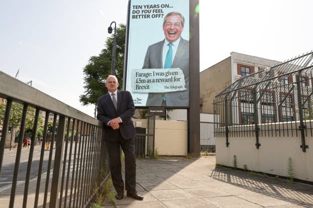 June 23, 2026, London, London, UK: London, UK. Liberal Democrat leader Ed Davey poses in front of a digital billboard in Fulham, London, during the launch of the Liberal Democrats new national campaign targeting Reform UK leader Nigel Farage and highlighting a Â£5 million gift he received, as the party marks the 10th anniversary of the Brexit referendum. London UK  - ZUMAl94_ 20260623_zaf_l94_033 Copyright: xDinendraxHariax