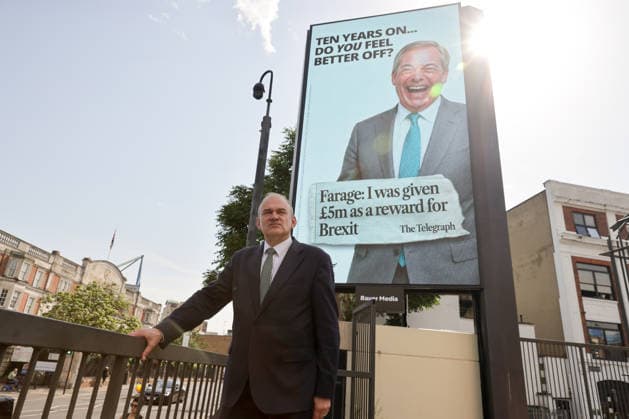 June 23, 2026, London, London, UK: London, UK. Liberal Democrat leader Ed Davey poses in front of a digital billboard in Fulham, London, during the launch of the Liberal Democrats new national campaign targeting Reform UK leader Nigel Farage and highlighting a Â£5 million gift he received, as the party marks the 10th anniversary of the Brexit referendum. London UK  - ZUMAl94_ 20260623_zaf_l94_036 Copyright: xDinendraxHariax