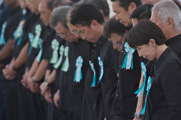 Japan s Prime Minister Sanae Takaichi offers silent prayer during the memorial service for all war dead of Battle of Okinawa at the Peace Memorial Park in Itoman, Okinawa-Prefecture, Japan on Tuesday, June 23, 2026.  TKP2026062307 KEIZOxMORI