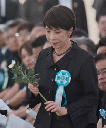 Japan s Prime Minister Sanae Takaichi offers flowers during the memorial service for all war dead of Battle of Okinawa at the Peace Memorial Park in Itoman, Okinawa-Prefecture, Japan on Tuesday, June 23, 2026.  TKP2026062310 KEIZOxMORI