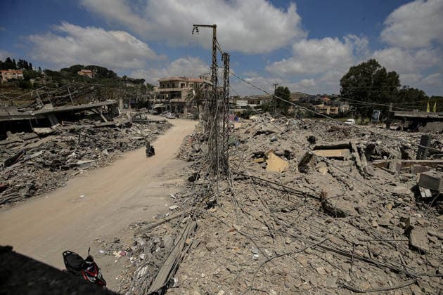 June 23, 2026, Mayfadoun, Mayfadoun, Lebanon: A motorist drives between rubble of buildings that were demolished by Israeli air strikes in the southern Lebanese village of Mayfadoun. Scores of Lebanese who fled their villages started to return to face a devastating shock of finding their homes completely demolished. Following the recent US-Iran deal, residents have attempted to return, only to be met with scenes of rubble and ash. Mayfadoun Lebanon  - ZUMAn313 20260623_zip_n313_009 Copyright: xMarwanxNaamanix