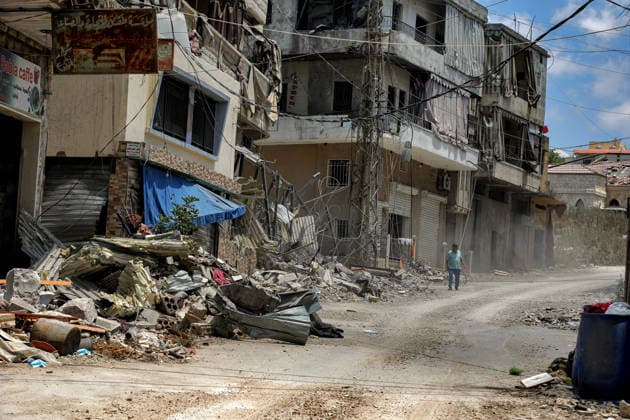 June 23, 2026, Nabatieh, Nabatieh, Lebanon: A Lebanese elderly walks in a devastated alley in the southern Lebanese city of Nabatieh caused by Israeli air strikes. Scores of Lebanese who fled their villages started to return to face a devastating shock of finding their homes completely demolished. Following the recent US-Iran deal, residents have attempted to return, only to be met with scenes of rubble and ash. Nabatieh Lebanon - ZUMAn313 20260623_zip_n313_013 Copyright: xMarwanxNaamanix