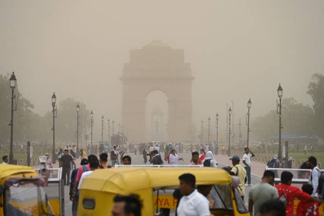 People walk on Kartavya Path amid dust storm and gusty winds New Delhi, Jun 23 (ANI): People walk on Kartavya Path amid dust storm and gusty winds, in New Delhi on Tuesday. New Delhi Delhi India Copyright: xANIx ANI_20260623329