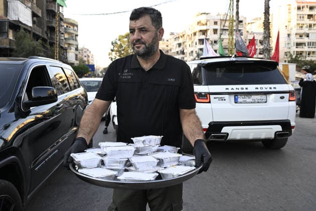 Muharram events in Lebanon held under the shadow of Israeli attacks BEIRUT, LEBANON - JUNE 23: Ashura and food prepared in charity tents are distributed to locals in the Dahieh district, south of Lebanon s capital Beirut, on the occasion of the arrival of the month of Muharram and the anniversary of the Karbala, amid ongoing Israeli attacks, on June 23, 2026. Houssam Shbaro Anadolu Beirut Lebanon. Editorial use only. Please get in touch for any other usage.  Copyright: x2026xAnadoluxHoussamxShbarox