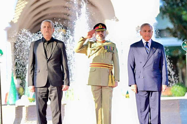 (260623) -- ISLAMABAD, June 23, 2026 -- Pakistani Prime Minister Shehbaz Sharif (R) and visiting Iranian President Masoud Pezeshkian (L) review guard of honor in Islamabad, Pakistan, June 23, 2026. Pakistani Prime Minister Shehbaz Sharif said at a joint press conference with Iranian President Masoud Pezeshkian on Tuesday that he will visit Iran next week to pay respects to late Iranian Supreme Leader Ayatollah Ali Khamenei and reaffirm Pakistan s solidarity with Iran. The Iranian president arrived in Pakistan on Tuesday for an official visit to discuss the ongoing diplomatic efforts following the signing of the U.S.-Iran memorandum of understanding. ( Handout via Xinhua) PAKISTAN-ISLAMABAD-PM-IRAN-PRESIDENT-MEETING PID 