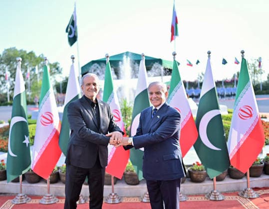 (260623) -- ISLAMABAD, June 23, 2026 -- Pakistani Prime Minister Shehbaz Sharif (R) shakes hands with visiting Iranian President Masoud Pezeshkian in Islamabad, Pakistan, June 23, 2026. Pakistani Prime Minister Shehbaz Sharif said at a joint press conference with Iranian President Masoud Pezeshkian on Tuesday that he will visit Iran next week to pay respects to late Iranian Supreme Leader Ayatollah Ali Khamenei and reaffirm Pakistan s solidarity with Iran. The Iranian president arrived in Pakistan on Tuesday for an official visit to discuss the ongoing diplomatic efforts following the signing of the U.S.-Iran memorandum of understanding. ( Handout via Xinhua) PAKISTAN-ISLAMABAD-PM-IRAN-PRESIDENT-MEETING PID 