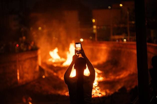 TENERIFE, CANARY ISLANDS, SPAIN - JUNE 23. Residents of Maria JimÃ nez, a coastal neighborhood in Santa Cruz de Tenerife, celebrate the traditional San Juan bonfires, a festivity deeply rooted in local culture and passed down through generations. Every year, neighbors gather to build and light the bonfires that illuminate the shoreline on the eve of June 24, marking the arrival of summer and symbolizing renewal, purification, and community spirit. The tradition remains one of the most anticipated events in the neighborhood, bringing together families and visitors in a celebration that reflects the strong social bonds and cultural heritage of the area. AndrÃ s GutiÃ rrez JNA Press Tenerife Spain Copyright: x xAndrÃ sxGutiÃ rrezx xJNAxPressx
