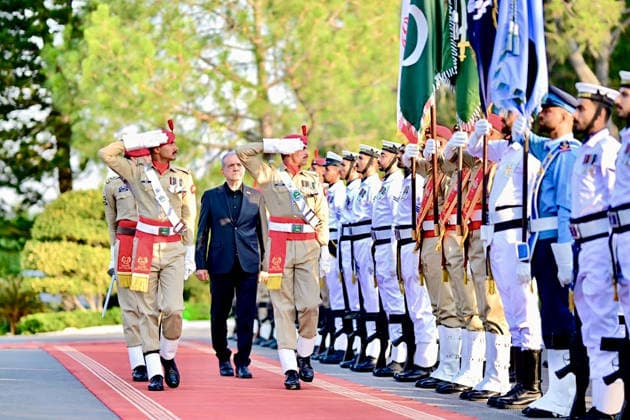 June 23, 2026, Peshawar, Peshawar, Pakistan: Iranian President Masoud Pezeshkian Reviews Honor Guard During Welcome Ceremony in Islamabad..Islamabad, Pakistan, June 23, 2026: Masoud Pezeshkian reviews an honor guard during an official welcome ceremony in Islamabad on June 23, 2026. Pezeshkian is in Pakistan to participate in ongoing diplomatic discussions and U.S.-Iran peace talks hosted by Pakistan. The visit underscores efforts to promote regional dialogue, diplomatic engagement, and international cooperation. Peshawar Pakistan - ZUMAa217 20260623_znp_a217_040 Copyright: xHussainxAlix