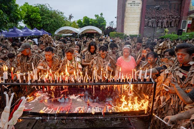 June 24, 2026, Manila, Manila, Philippines: Devotees spread mud on their bodies and put on banana leaves for the mass celebrating Taong Putik Festival in Bibiclat, Aliaga, Nueva Ecija every June 24. The festival honors Saint John the Baptist and honors a miracle during the Second World War, when the execution of Filipino prisoners of war was called off after a sudden downpour. Manila Philippines  - ZUMAs361 20260624_zip_s361_007 Copyright: xJyorxSox