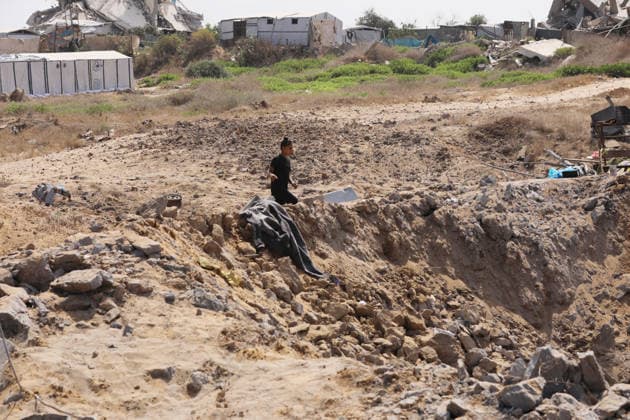 Displaced Palestinians inspect damaged tents after strike in Gaza City Displaced Palestinians inspect their heavily damaged tents near a displacement camp in the Sheikh Ajlin neighborhood, west of Gaza City, on June 24, 2026. An Israeli military strike overnight hit the coastal area where thousands of displaced families have sought shelter, leaving a large crater and causing extensive damage to displacement tents despite a ceasefire agreement being in force. Photo by Belal Osama apaimages Gaza Gaza Strip Palestinian Territory 240626_Gaza_BO_00(59) Copyright: xapaimagesxBelalxOsamax xapaimagesx