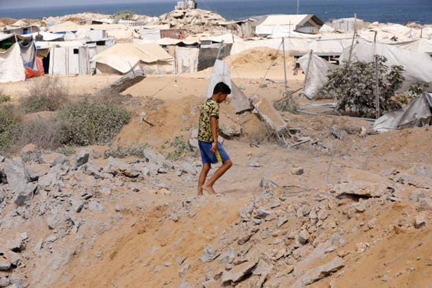 Displaced Palestinians inspect damaged tents after strike in Gaza City Displaced Palestinians inspect their heavily damaged tents near a displacement camp in the Sheikh Ajlin neighborhood, west of Gaza City, on June 24, 2026. An Israeli military strike overnight hit the coastal area where thousands of displaced families have sought shelter, leaving a large crater and causing extensive damage to displacement tents despite a ceasefire agreement being in force. Photo by Belal Osama apaimages Gaza Gaza Strip Palestinian Territory 240626_Gaza_BO_00(29) Copyright: xapaimagesxBelalxOsamax xapaimagesx