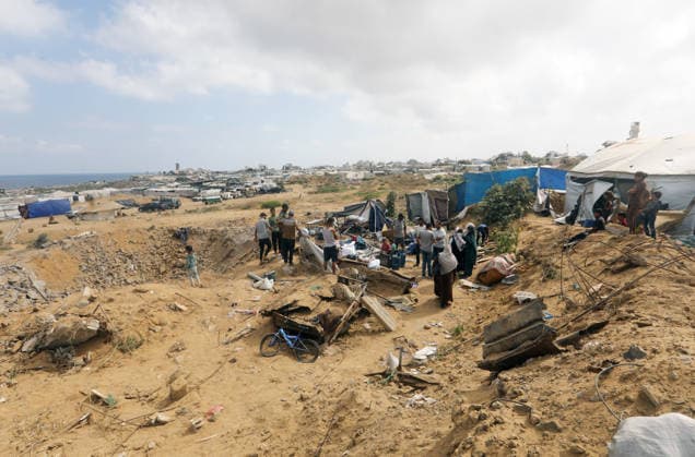Displaced Palestinians inspect damaged tents after strike in Gaza City Displaced Palestinians inspect their heavily damaged tents near a displacement camp in the Sheikh Ajlin neighborhood, west of Gaza City, on June 24, 2026. An Israeli military strike overnight hit the coastal area where thousands of displaced families have sought shelter, leaving a large crater and causing extensive damage to displacement tents despite a ceasefire agreement being in force. Photo by Belal Osama apaimages Gaza Gaza Strip Palestinian Territory 240626_Gaza_BO_00(6) Copyright: xapaimagesxBelalxOsamax xapaimagesx
