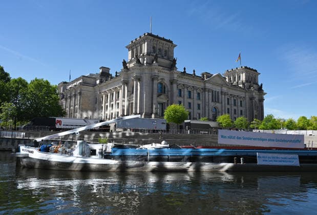 Cargo ship blocks Spree River during rally in Berlin BERLIN, GERMANY - JUNE 24: A cargo ship blocks the Spree River in front of the Reichstag building and the Paul-Lobe-Haus during a demonstration organized by MIRO, the German minerals and aggregates industry association, in Berlin, Germany, on June 24, 2026. The vessel, loaded with construction aggregates, was used to draw attention to calls for stronger legal protection of mineral deposits and greater consideration of domestic mineral resource extraction and processing in spatial planning legislation. Volodymyr Sindieiev Anadolu Berlin Germany. Editorial use only. Please get in touch for any other usage.  Copyright: x2026xAnadoluxVolodymyrxSindieievx