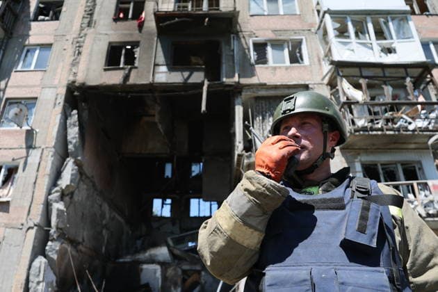 RUSSIA, GORLOVKA - JUNE 24, 2026: A first responder of the Russian Emergencies Ministry works by an apartment block destroyed in a drone attack. Dmitry Yagodkin TASS  94215090
