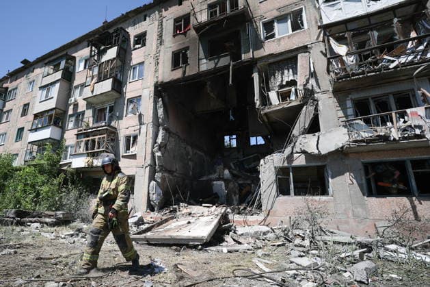 RUSSIA, GORLOVKA - JUNE 24, 2026: A first responder of the Russian Emergencies Ministry works by an apartment block destroyed in a drone attack. Dmitry Yagodkin TASS  94215078