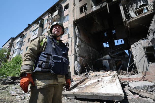 RUSSIA, GORLOVKA - JUNE 24, 2026: A first responder of the Russian Emergencies Ministry works by an apartment block destroyed in a drone attack. Dmitry Yagodkin TASS  94215087