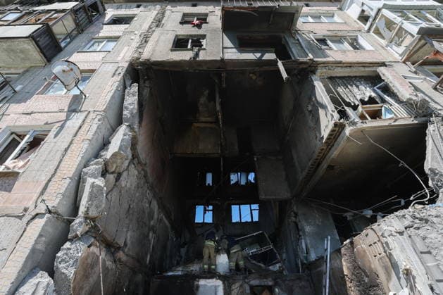 RUSSIA, GORLOVKA - JUNE 24, 2026: First responders of the Russian Emergencies Ministry work in an apartment block destroyed in a drone attack. Dmitry Yagodkin TASS  94215096