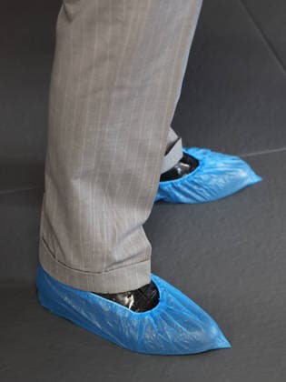 The King Hears How The Charity Reorg Uses Jiu Jitsu To Support Those Facing Physical, Mental And Social Challenges LONDON, ENGLAND - JUNE 24: Blue plastic shoe covers worn by King Charles III during a visit to charity REORG at the Roger Gracie Brazilian Jiu Jitsu Academy on June 24, 2026 in London, England. REORG supports military personnel, veterans and emergency service workers through Brazilian Jiu Jitsu training in safe and supportive environments., Credit:Chris Jackson PA ROTA - B68 Avalon United Kingdom, England, London  Copyright: xChrisxJacksonx xPAxROTAx-xB68x xAvalonx 1112203216