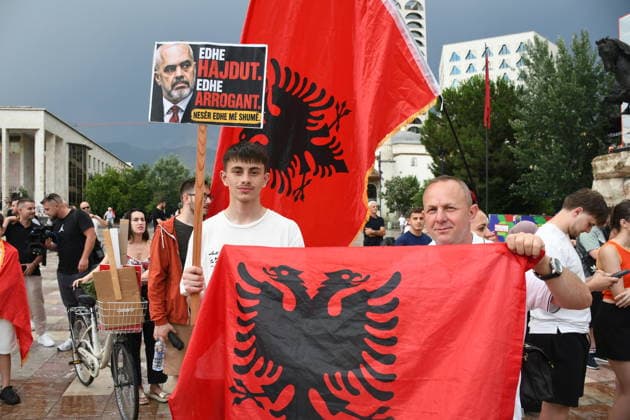Demonstrations over controversial Vlora tourism project enter 25th day in Tirana TIRANA, ALBANIA - JUNE 24: Protesters gather at Skanderbeg Square despite the rain on the 25th day of demonstrations against a planned tourism development project in the Zvernec region of Vlora, holding banners with the slogan Albania is not for sale in Tirana, Albania on June 24, 2026. Olsi Shehu Anadolu Tirana World. Editorial use only. Please get in touch for any other usage.  Copyright: x2026xAnadoluxOlsixShehux