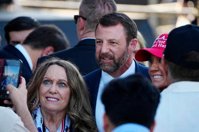 United States Secretary of Homeland Security Markwayne Mullin greets attendees before President Donald Trump speaks at a rally to kick off the 16-day Great American State Fair as part of Washington, D.C. s celebration of the nation s 250th birthday on the National Mall on Wednesday, June 24, 2026. The rally will include military flyovers, musical performances from Lee Greenwood and Christopher Macchio, and the U.S. Army Band, the U.S. Marine Band and Armed Forces choirs.  WAP20260624343 BONNIExCASH