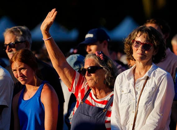 Attendees raise their hands in prayer before President Donald Trump speaks at a rally to kick off the 16-day Great American State Fair as part of Washington, D.C. s celebration of the nation s 250th birthday on the National Mall on Wednesday, June 24, 2026. The rally will include military flyovers, musical performances from Lee Greenwood and Christopher Macchio, and the U.S. Army Band, the U.S. Marine Band and Armed Forces choirs.  WAP20260624352 BONNIExCASH