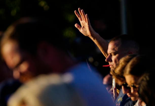 Attendees raise their hands in prayer before President Donald Trump speaks at a rally to kick off the 16-day Great American State Fair as part of Washington, D.C. s celebration of the nation s 250th birthday on the National Mall on Wednesday, June 24, 2026. The rally will include military flyovers, musical performances from Lee Greenwood and Christopher Macchio, and the U.S. Army Band, the U.S. Marine Band and Armed Forces choirs.  WAP20260624353 BONNIExCASH