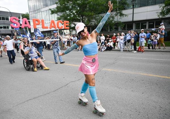 June 24, 2026, Montreal, Pq, Canada: A participant entertains the crowd during the Saint-Jean-Baptiste Day parade in Montreal, on Wednesday, June 24, 2026. Montreal Canada  - ZUMAc35_ 20260624_zaf_c35_179 Copyright: xGrahamxHughesx