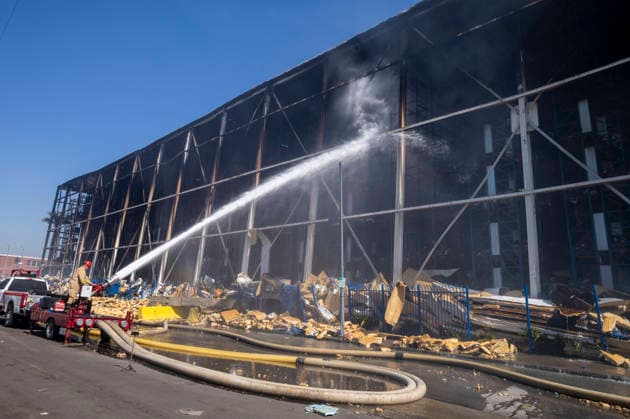 June 24, 2026, Los Angeles, California, USA: Firefighters continue working at the scene of a warehouse fire in the Boyle Heights neighborhood of Los Angeles on Tuesday, June 24, 2026. Los Angeles USA - ZUMAc68_ 20260624_zaf_c68_008 Copyright: xRingoxChiux
