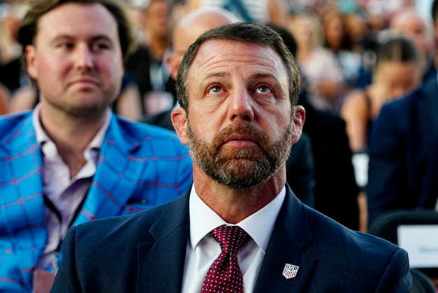 United States Secretary of Homeland Security Markwayne Mullin waits for President Donald Trump to speak at a rally to kick off the 16-day Great American State Fair as part of Washington, D.C. s celebration of the nation s 250th birthday on the National Mall on Wednesday, June 24, 2026. The rally will include military flyovers, musical performances from Lee Greenwood and Christopher Macchio, and the U.S. Army Band, the U.S. Marine Band and Armed Forces choirs.  WAP2026062437533 BONNIExCASH
