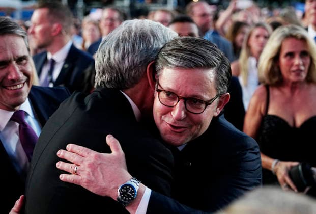 Speaker of the United States House of Representatives .Mike Johnson hugs Administrator of the Centers for Medicare & Medicaid Services (CMS) Dr. Mehmet Oz as they wait for President Donald Trump to speak at a rally to kick off the 16-day Great American State Fair as part of Washington, D.C. s celebration of the nation s 250th birthday on the National Mall on Wednesday, June 24, 2026. The rally will include military flyovers, musical performances from Lee Greenwood and Christopher Macchio, and the U.S. Army Band, the U.S. Marine Band and Armed Forces choirs.  WAP20260624380 BONNIExCASH