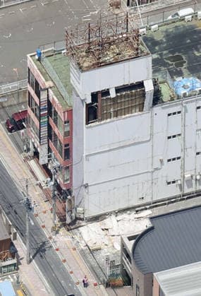 Powerful earthquake hits northeastern Japan Photo taken from a Kyodo News plane on June 25, 2026, shows a damaged exterior wall of a building in Hachinohe in Aomori Prefecture, after a preliminary magnitude-7.2 earthquake hit northeastern Japan.  A14AA0005620167P
