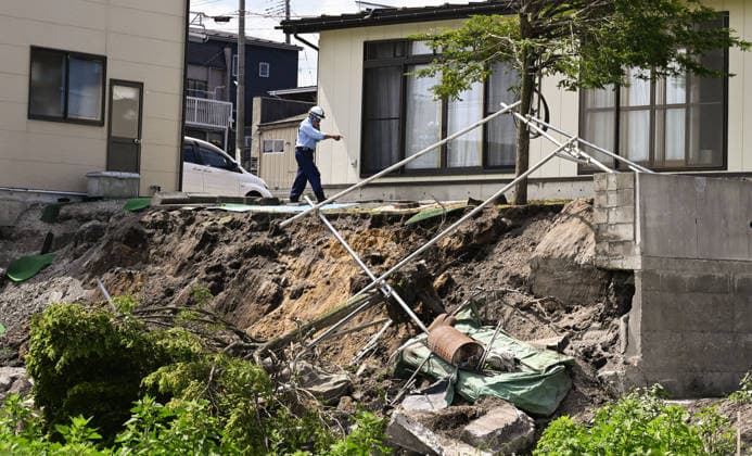 Powerful earthquake hits northeastern Japan A retaining wall is seen collapsed in Hachinohe in Aomori Prefecture on June 25, 2026, after a preliminary magnitude-7.2 earthquake hit northeastern Japan.  A14AA0005620171P