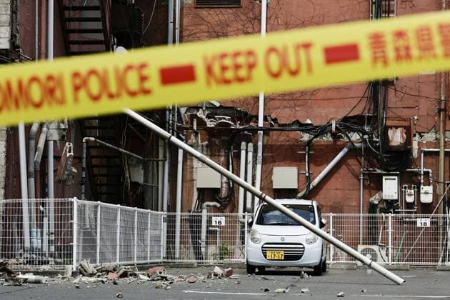 Powerful earthquake hits northeastern Japan Debris from a building s exterior wall is scattered across a parking lot in Hachinohe in Aomori Prefecture, on June 25, 2026, after a preliminary magnitude-7.2 earthquake hit northeastern Japan.  A14AA0005620174P