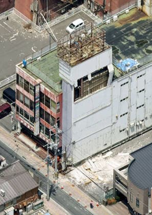 Powerful earthquake hits northeastern Japan Photo taken from a Kyodo News plane on June 25, 2026, shows a damaged exterior wall of a building in Hachinohe in Aomori Prefecture, after a preliminary magnitude-7.2 earthquake hit northeastern Japan.  A14AA0005620177P